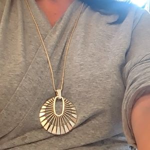 Long gold Kendra Scott starbursts pendant